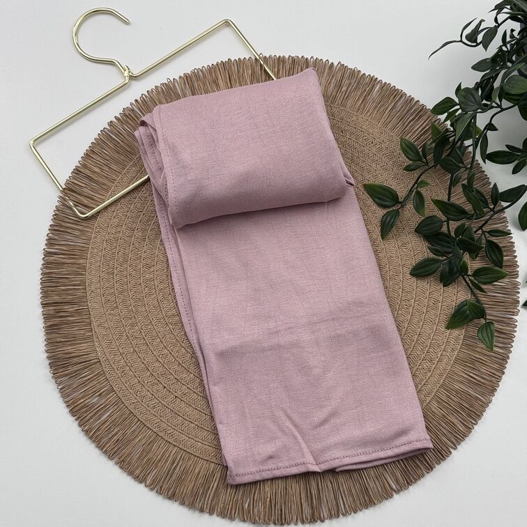 Jersey Hijab in Light Pink, soft and breathable with a thick, flexible design, providing secure coverage and easy styling for active, everyday wear.