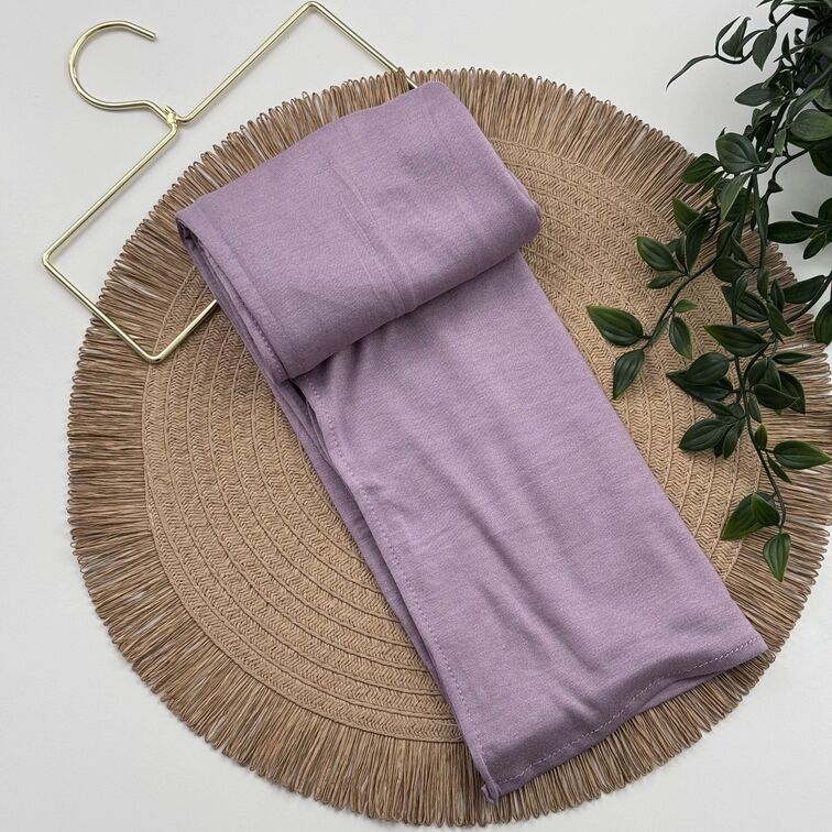 Jersey Hijab in Lavender Blush, soft and breathable with a thick, flexible design, providing secure coverage and easy styling for active, everyday wear.