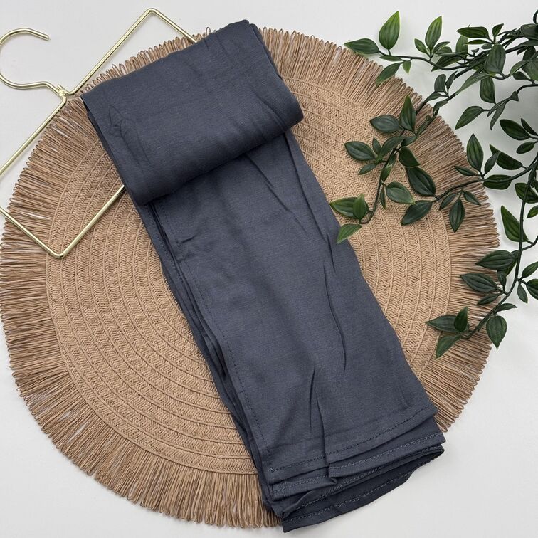 Jersey Hijab in Dim Grey, soft and breathable with a thick, flexible design, providing secure coverage and easy styling for active, everyday wear.