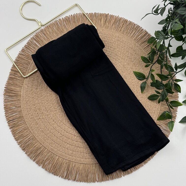 Jersey Hijab in Black, soft and breathable with a thick, flexible design, providing secure coverage and easy styling for active, everyday wear.