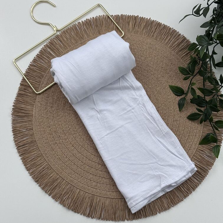 Jersey Hijab in White, soft and breathable with a thick, flexible design, providing secure coverage and easy styling for active, everyday wear.