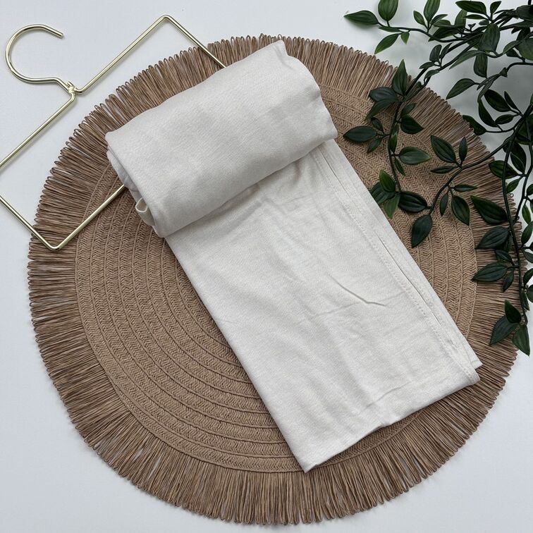 Jersey Hijab in Floral White, soft and breathable with a thick, flexible design, providing secure coverage and easy styling for active, everyday wear.