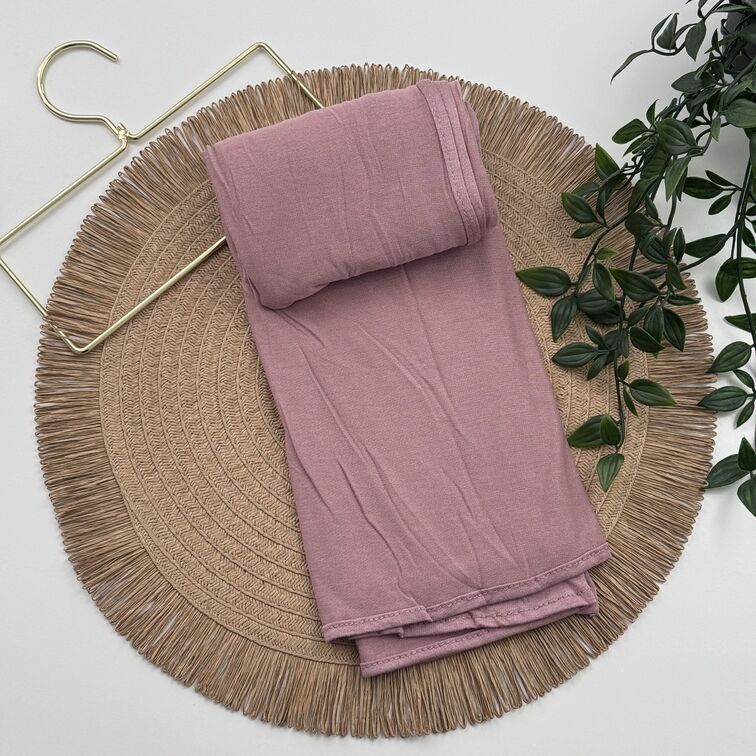 Jersey Hijab in Dark Salmon, soft and breathable with a thick, flexible design, providing secure coverage and easy styling for active, everyday wear.