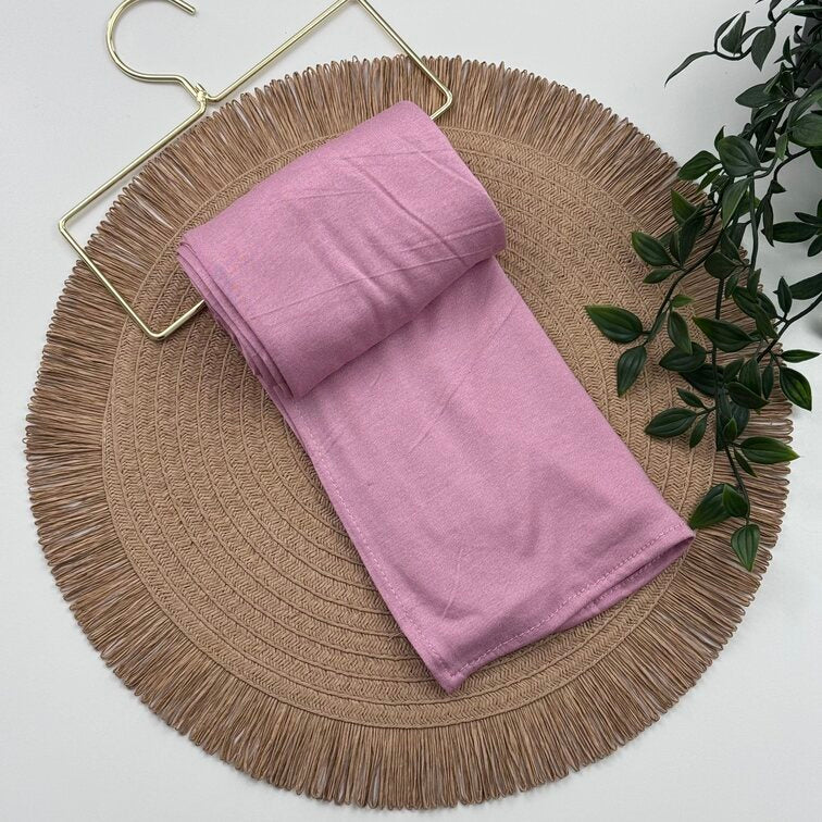 Jersey Hijab in Pink, soft and breathable with a thick, flexible design, providing secure coverage and easy styling for active, everyday wear.