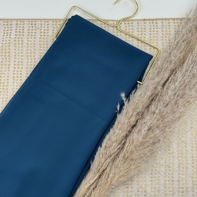 Chiffon Hijab in Steel Blue, lightweight and smooth with a soft drape, offering breathable comfort and versatile styling for everyday wear.