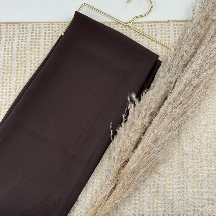 Chiffon Hijab in Dark Brown, lightweight and smooth with a soft drape, offering breathable comfort and versatile styling for everyday wear.