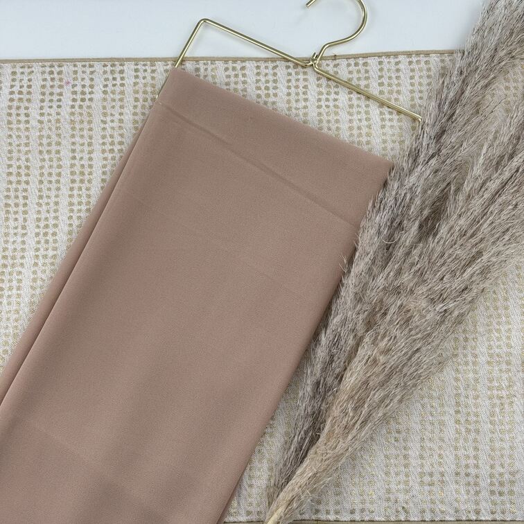 Chiffon Hijab in Bisque, lightweight and smooth with a soft drape, offering breathable comfort and versatile styling for everyday wear.