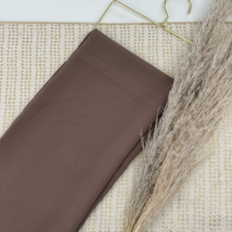 Chiffon Hijab in Brown, lightweight and smooth with a soft drape, offering breathable comfort and versatile styling for everyday wear.