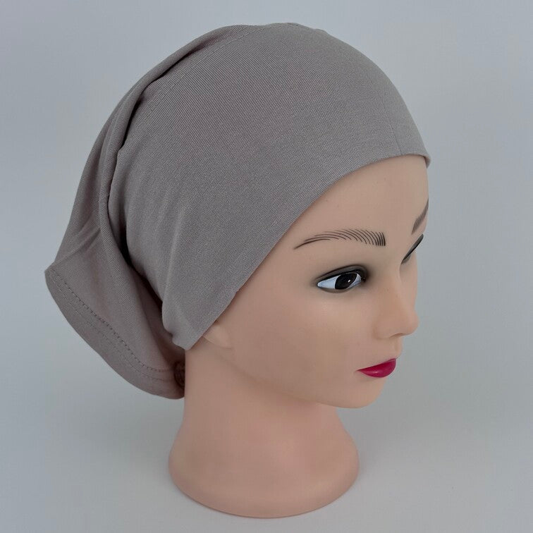Soft and breathable cotton hijab cap with a stretchable fit and a knitted floral design at the back for added elegance.