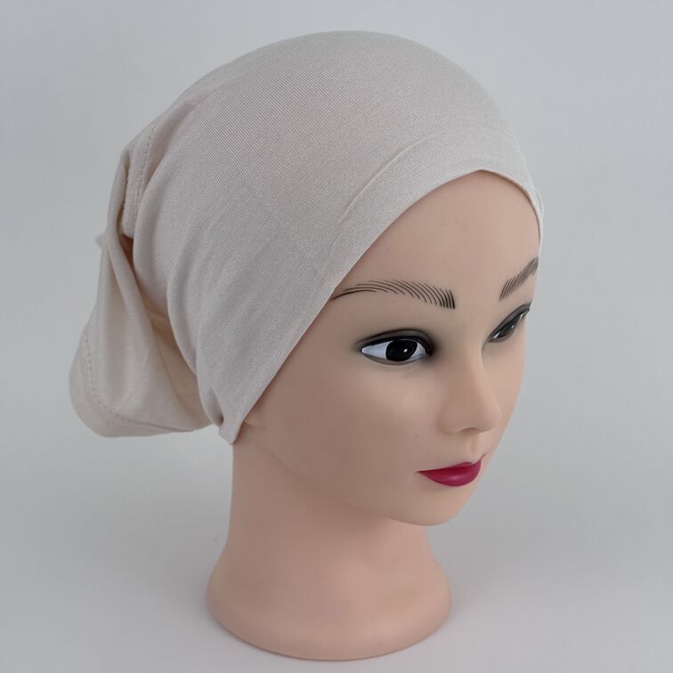 Soft and breathable cotton hijab cap with a stretchable fit and a knitted floral design at the back for added elegance.