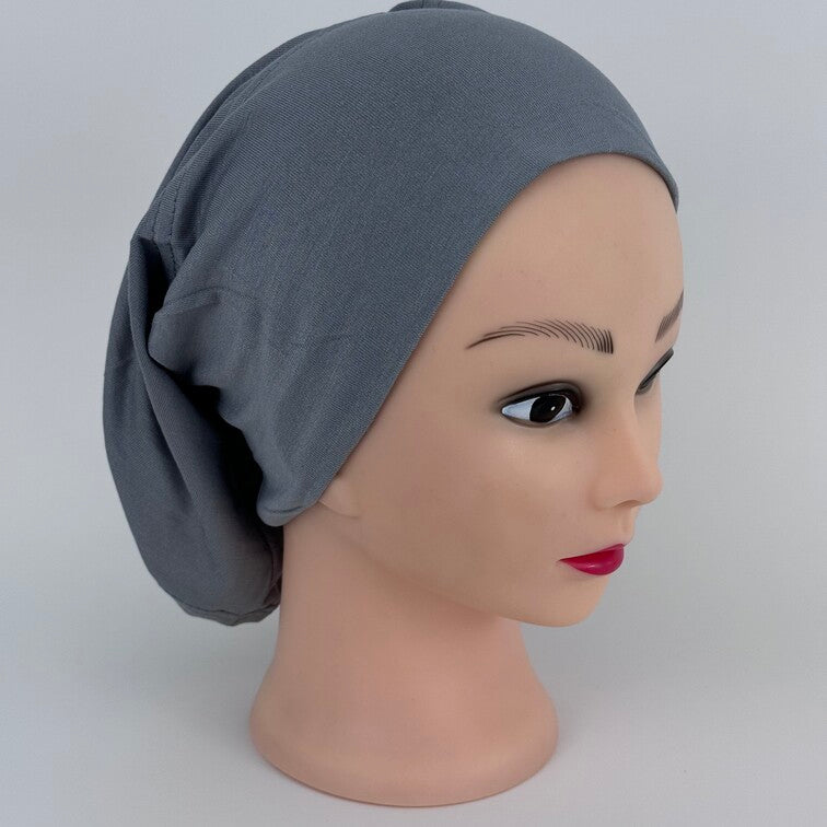 Soft and breathable cotton hijab cap with a stretchable fit and a knitted floral design at the back for added elegance.