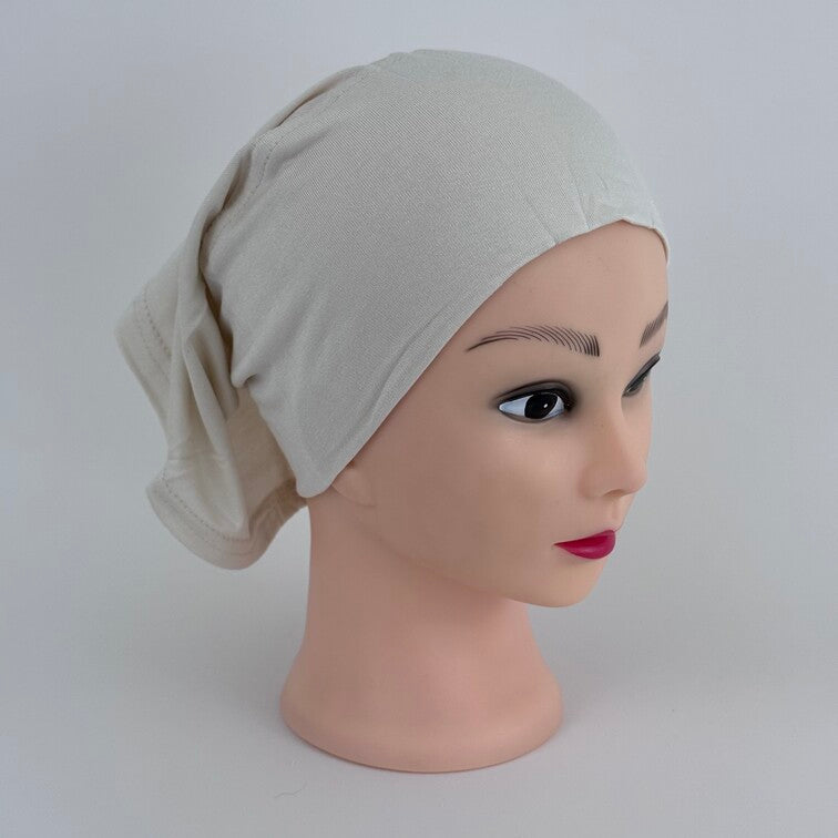 Soft and breathable cotton hijab cap with a stretchable fit and a knitted floral design at the back for added elegance.