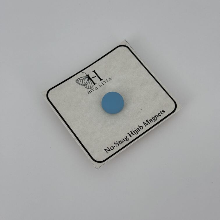 Strong and lightweight sky blue hijab magnets made from magnetic aluminum alloy, designed to secure delicate fabrics like chiffon and silk without causing damage.