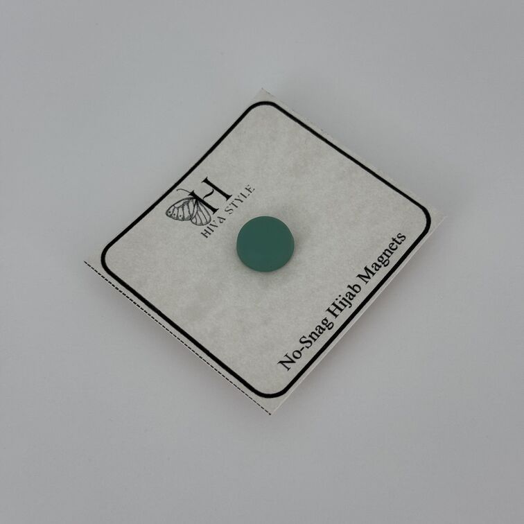 Strong and lightweight green hijab magnets made from magnetic aluminum alloy, designed to secure delicate fabrics like chiffon and silk without causing damage.